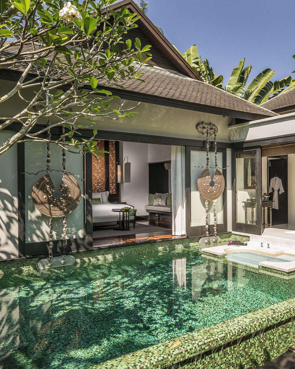 The bedroom opens directly to the private pool in a villa at Anantara Mai Khao Phuket Villas.