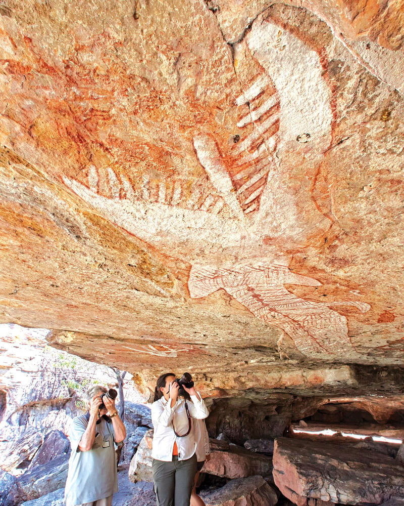 Two travelers photograph Arnhem Land’s Rainbow Serpent.