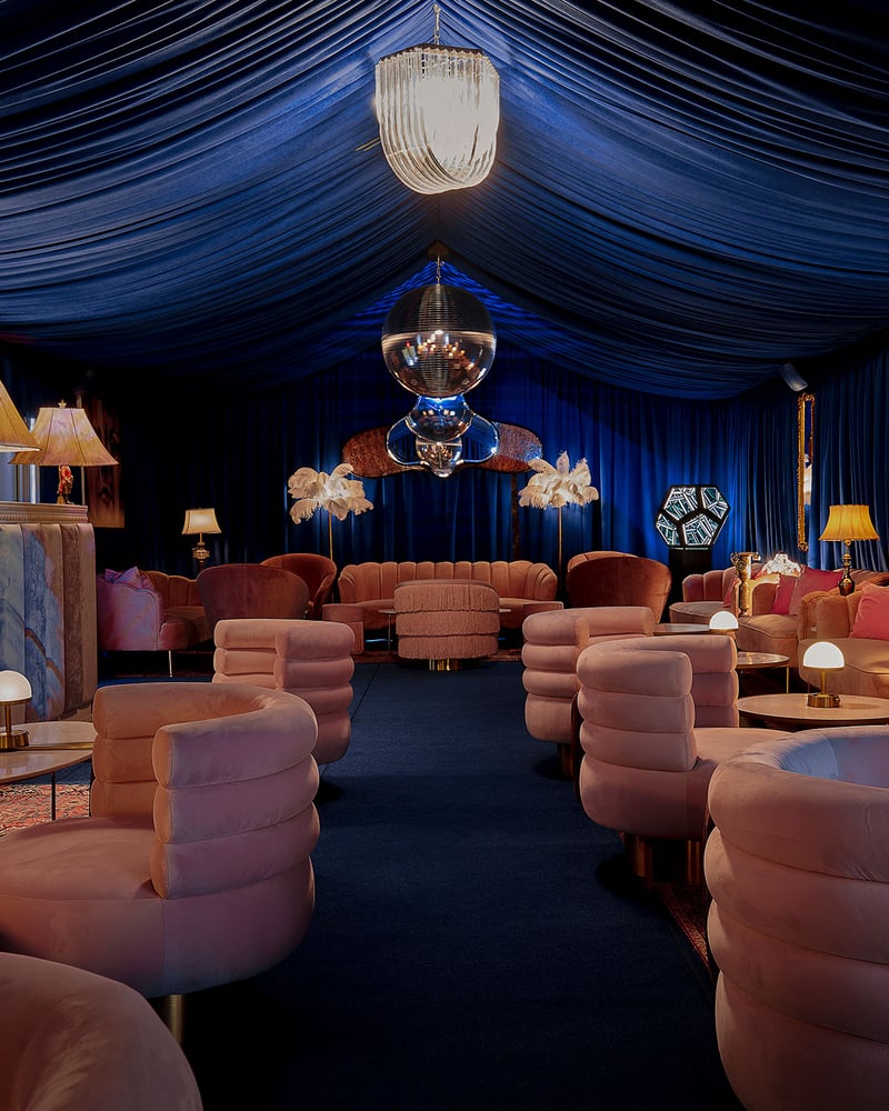 The rich blue walls and pink furniture of The St. Regis Aspen Resort’s Blue Room.
