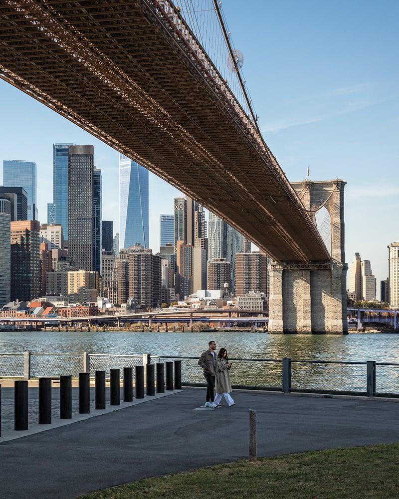 A view of Manhattan from underneath the Brooklyn Bridge.