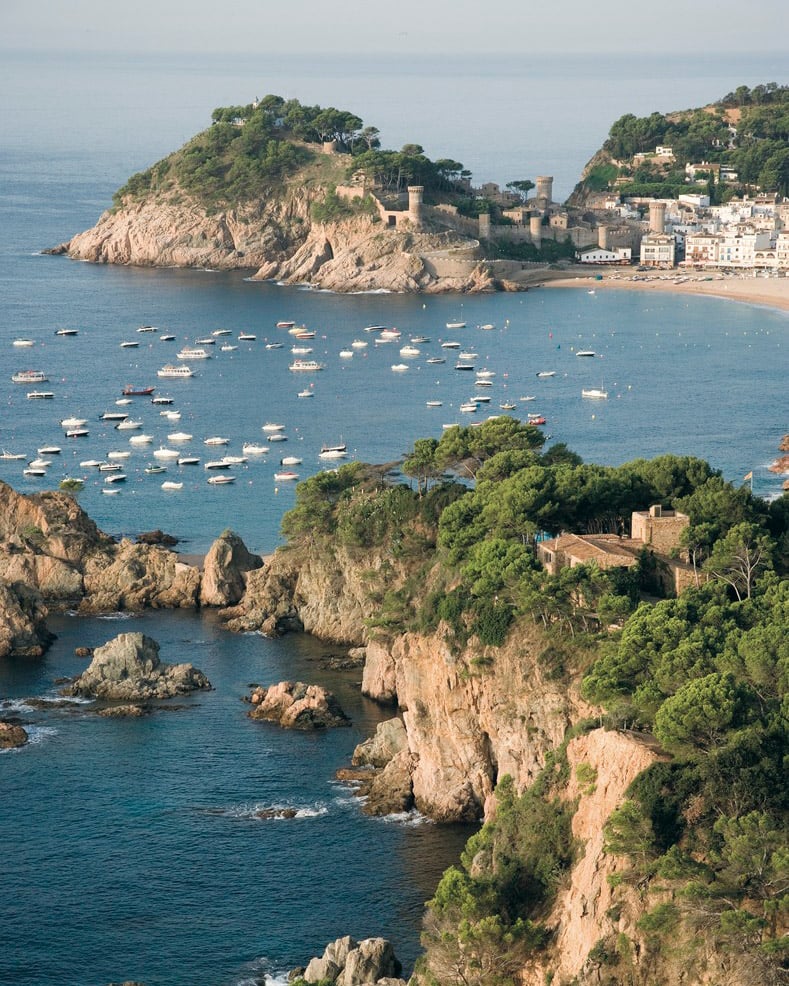Yachts anchored in a cove on the Costa Brava.