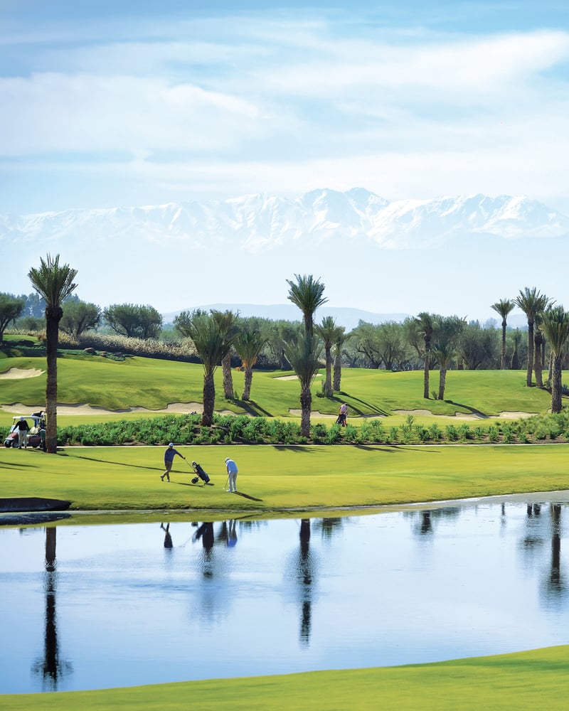 Golfers on the fairway at Fairmont Royal Palm Marrakech.