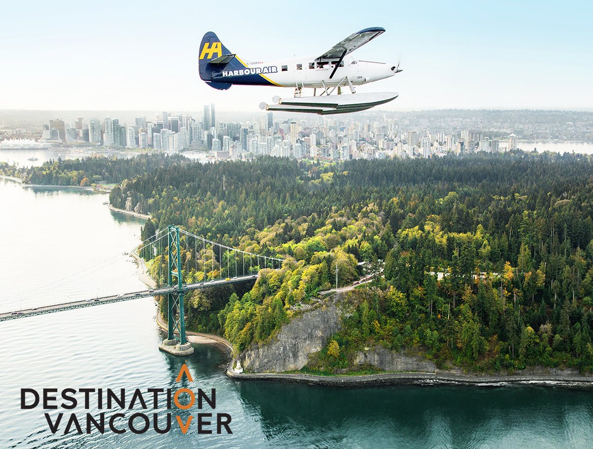 Image of a sea plane flying over Vancouver, BC