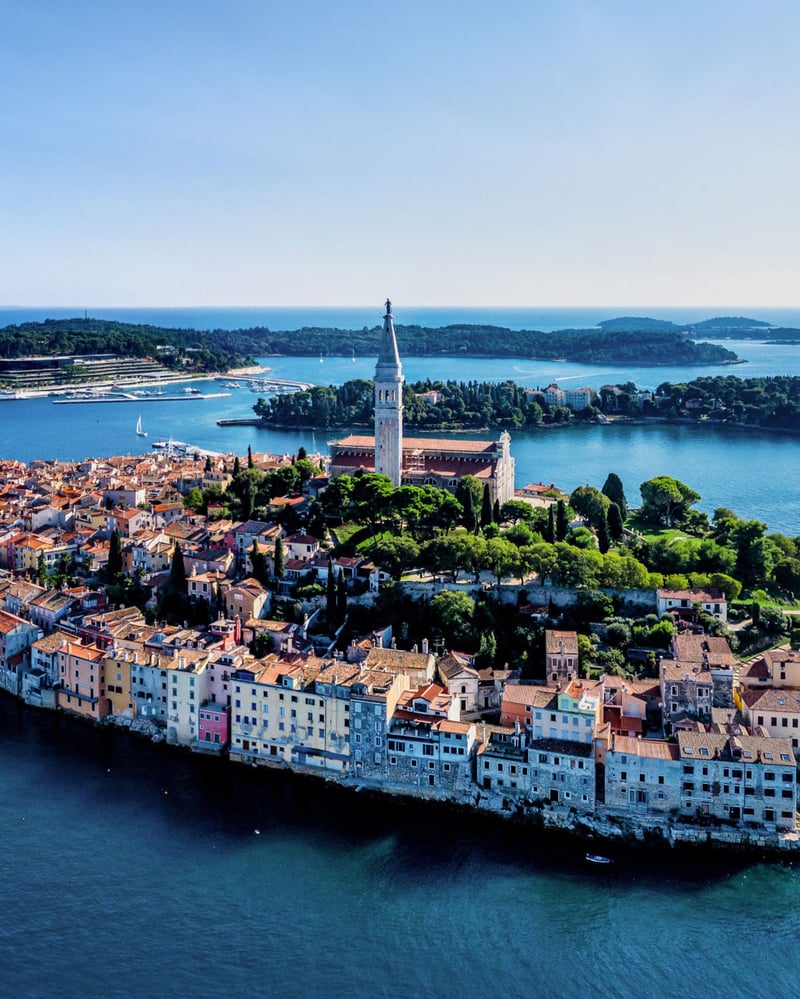 Historic buildings and a tower on island town Rovinj.