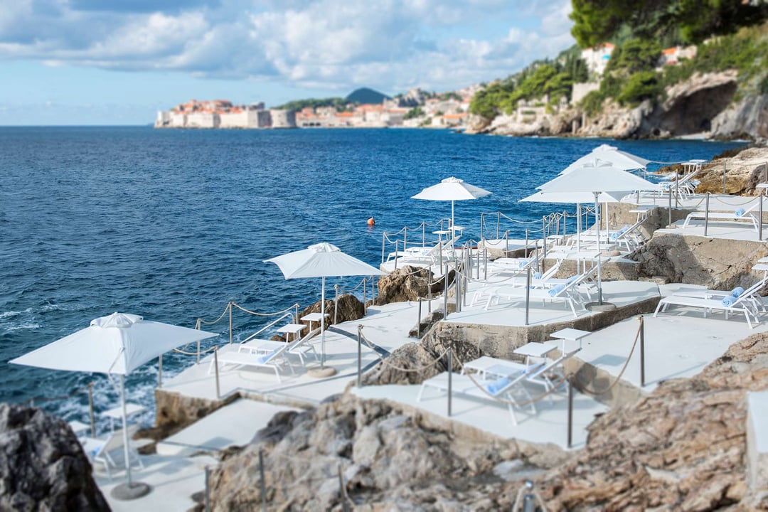 Sunbeds line the coast at Villa Dubrovnik in Croatia.