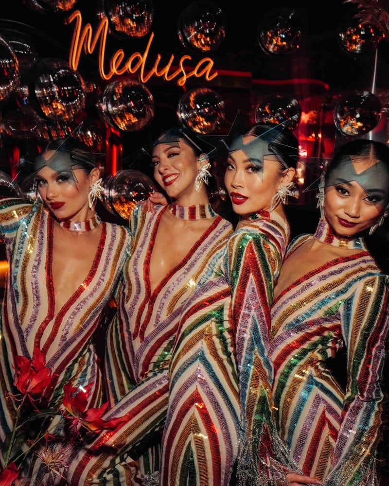 Four women in matching sparkly dresses at Medusa, the nightclub at Palm Beach Cannes.