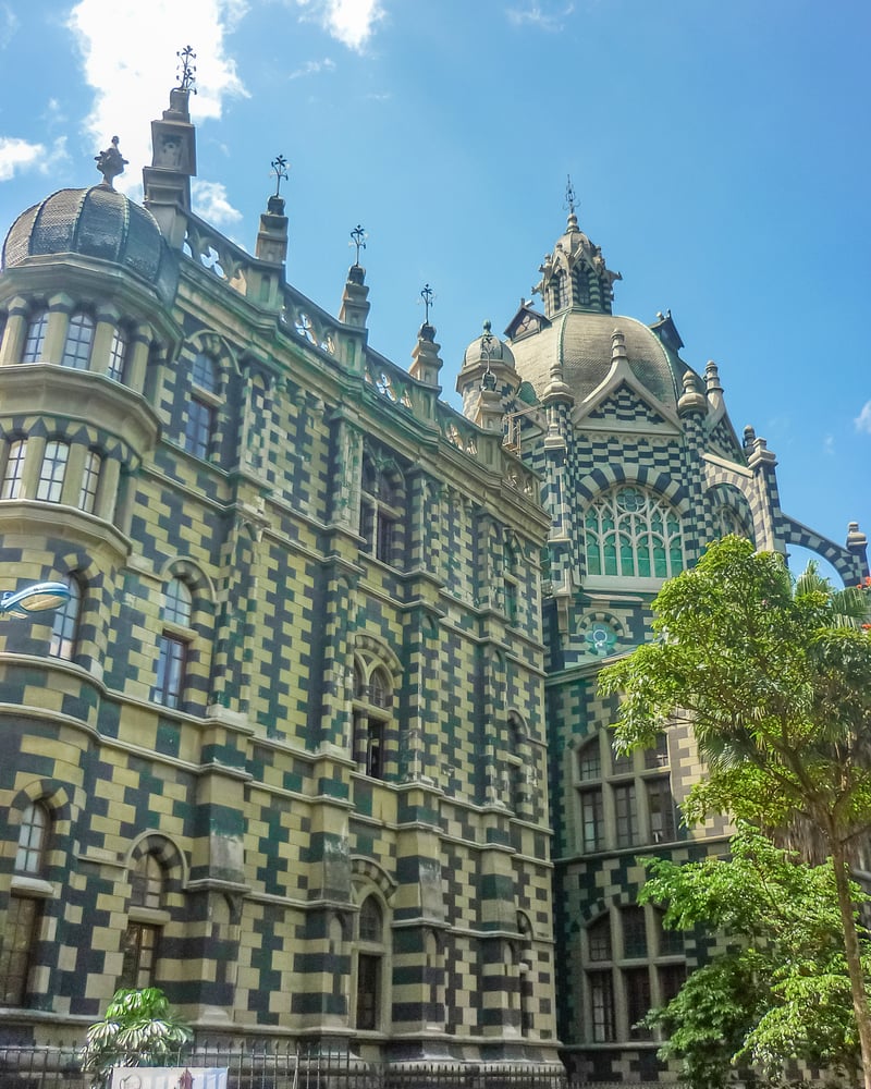 A green-and-white-checkered palace in Medellín’s Plaza Botero.