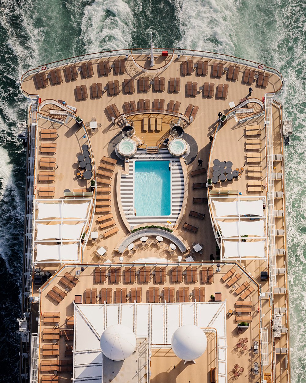 An overhead view of Queen Anne’s aft pool deck.