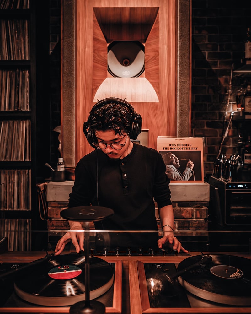 A DJ spins a record at Cave Shibuya.