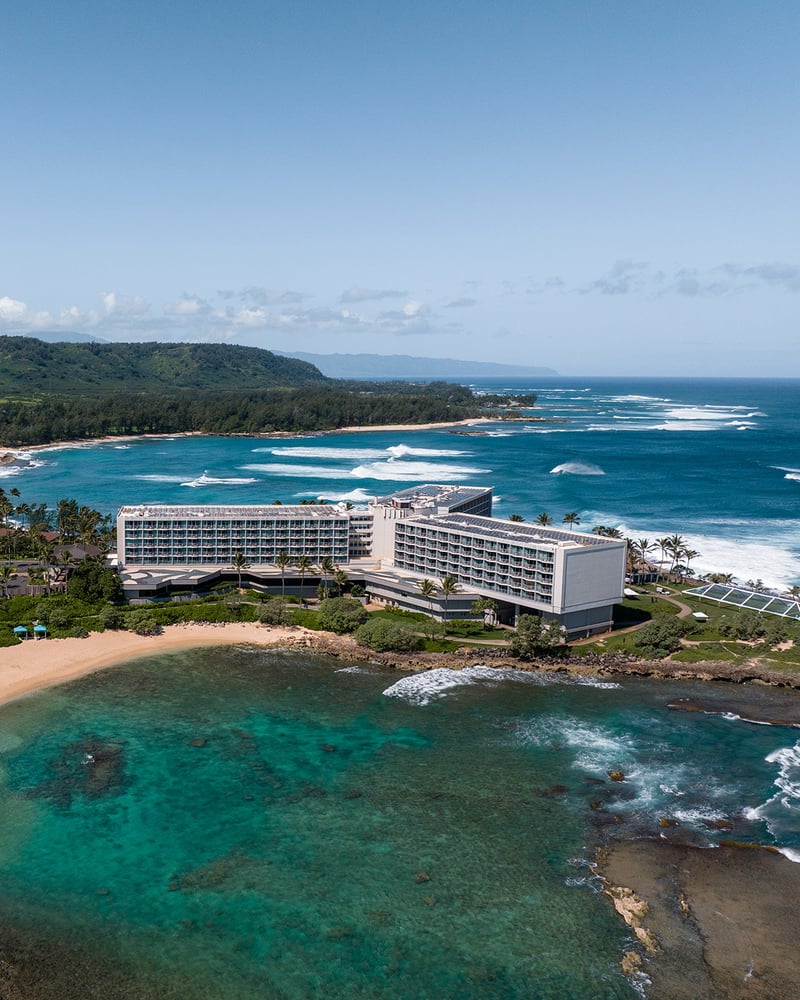 An overhead view of Turtle Bay Resort, surrounded by Oahu’s turquoise waters.