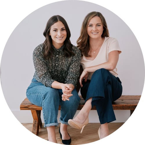 Jayme Jenkins (left) and Jessica Stevenson, both wearing neutral colors, smile at the camera.