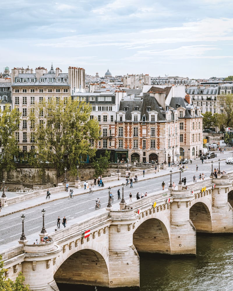Bikers and walkers on Paris’ Pont Neuf.