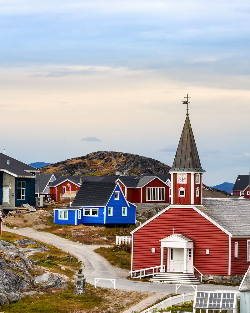 Bright red and blue buildings in Nuuk, Greenland.