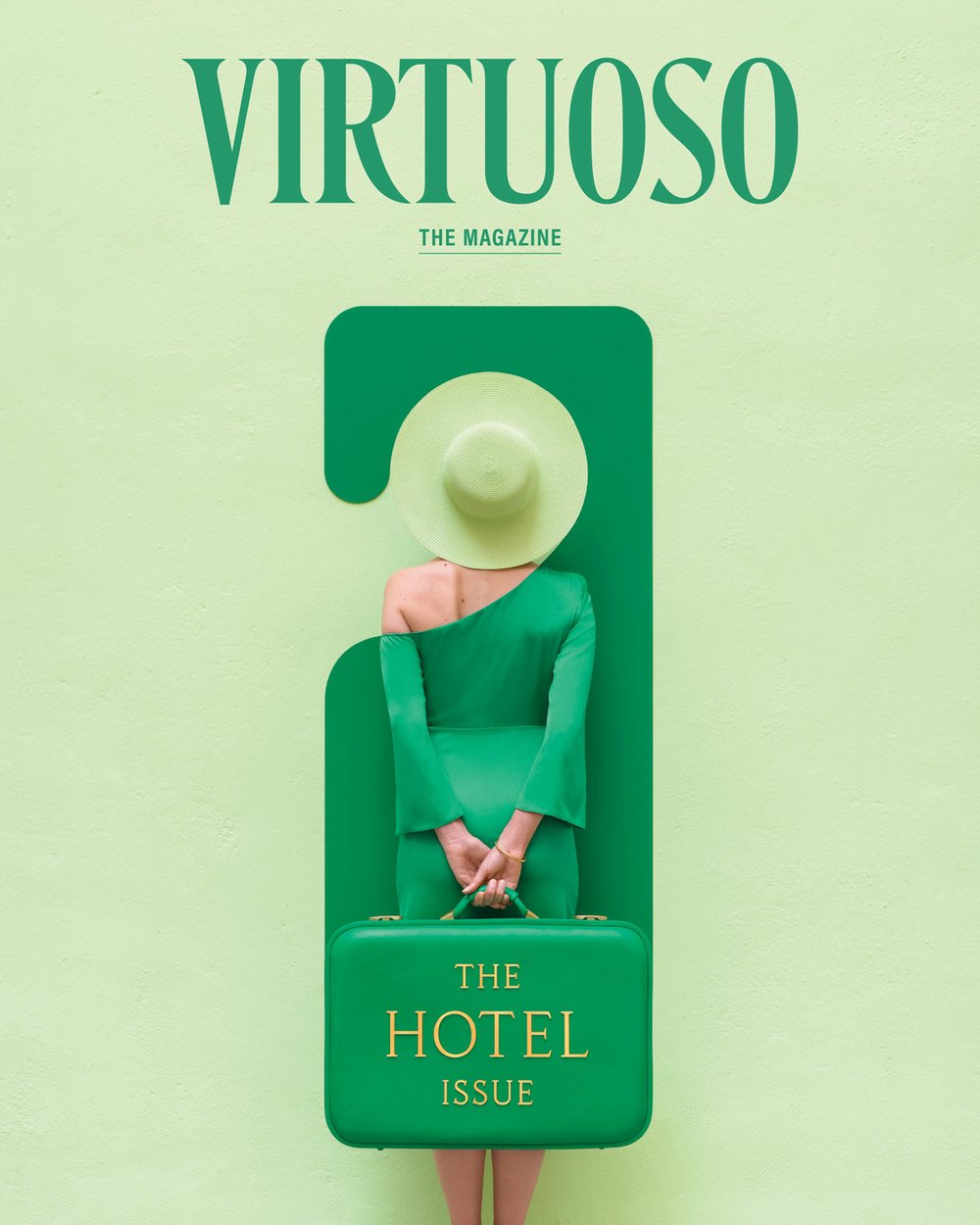 On the July cover of Virtuoso, The Magazine, a woman holding a green briefcase labeled “The Hotel Issue” stands inside the silhouette of a “Do not disturb” door hanger.