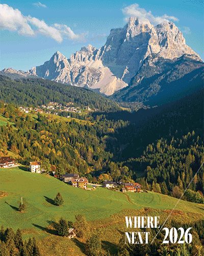 An animation with a logo reading “Where Next 2026” flashes between photographs of the Philippines, Miami, India’s Brahmaputra River, Kenya, and the Dolomites.